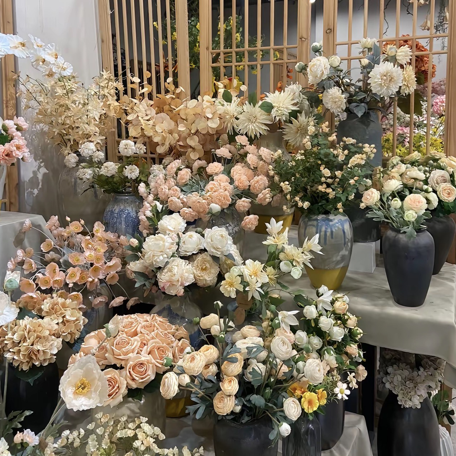 Champagne and cream artificial peony and rose arrangement display at PJTL wholesale showroom