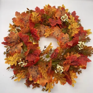 Artificial autumn maple leaf wreath with cream berry clusters
