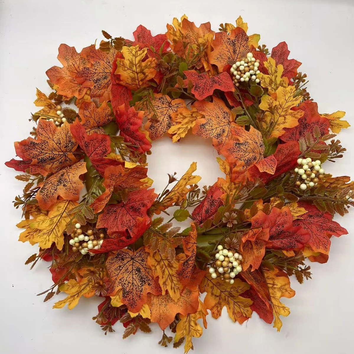 Artificial autumn maple leaf wreath with cream berry clusters