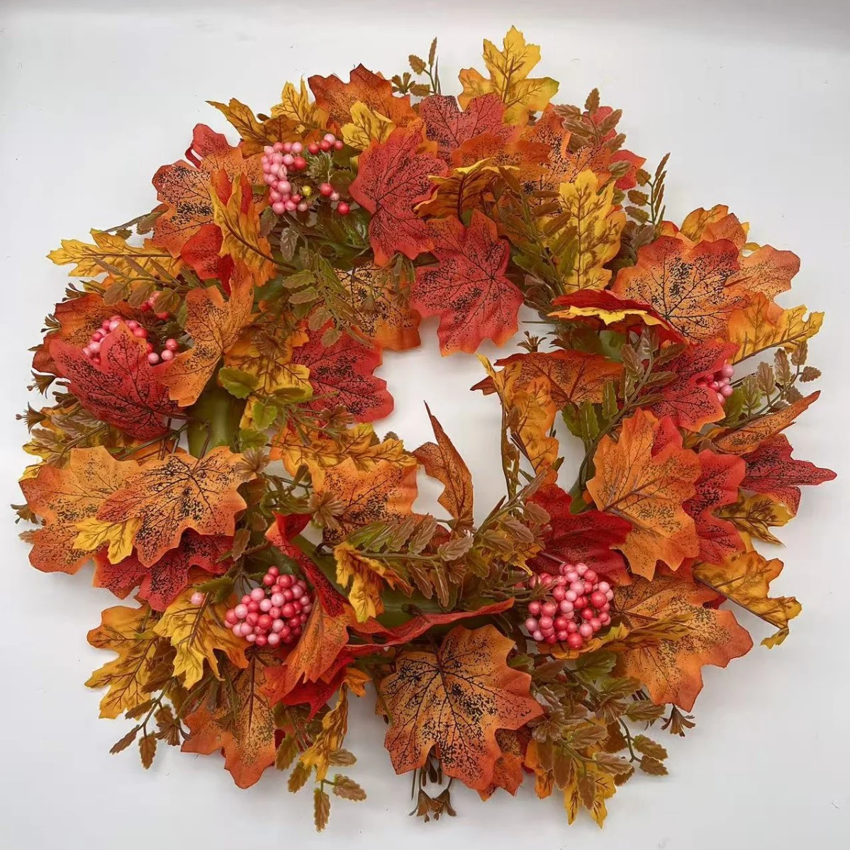 Artificial autumn maple leaf wreath with pink berry clusters