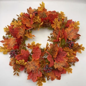 Artificial autumn maple leaf wreath with red berry clusters