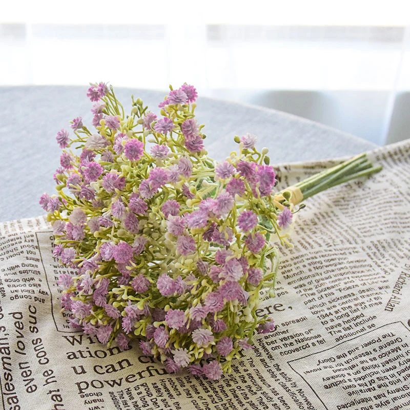 Alternate tabletop view of a lavender and white artificial baby's breath bouquet