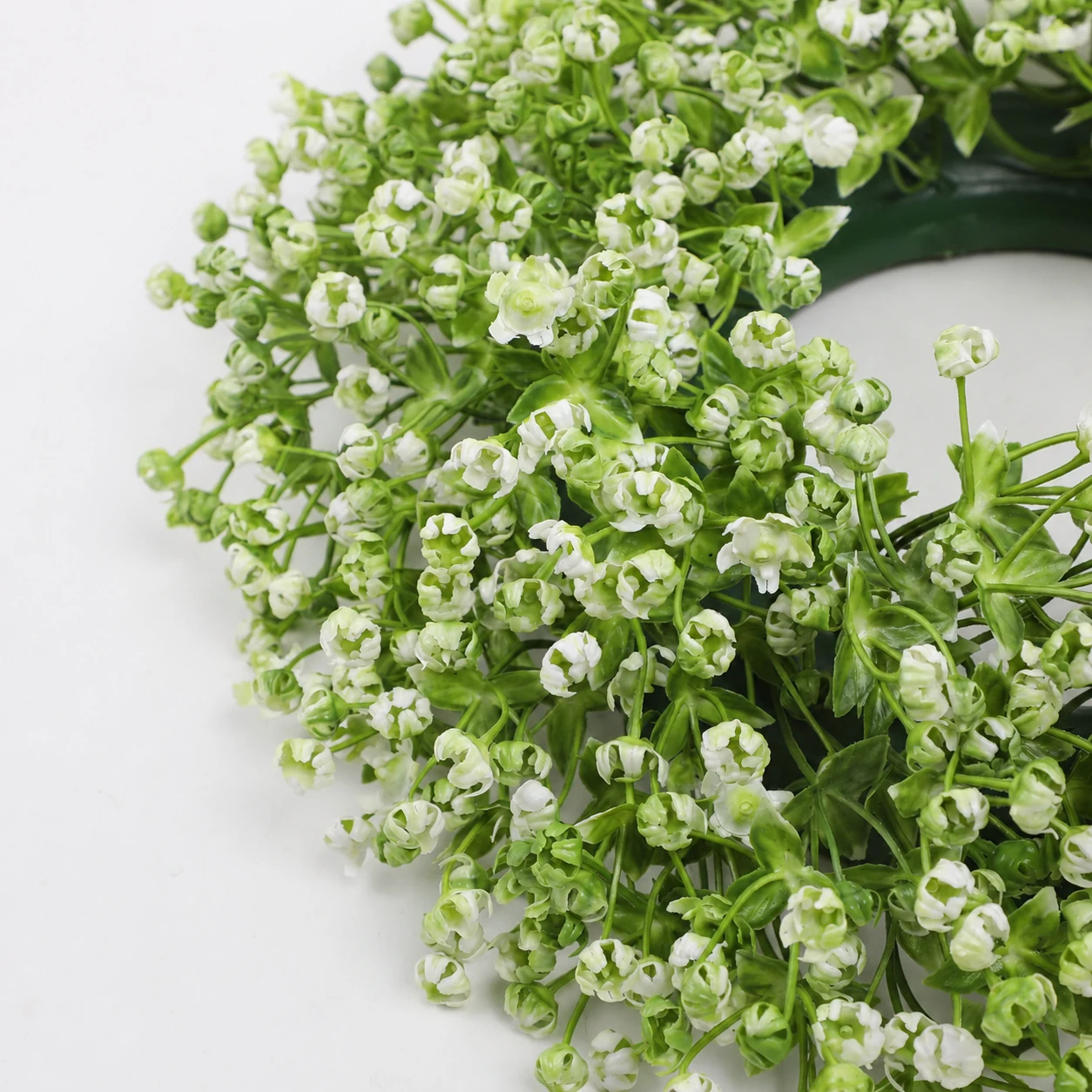 Close-up of white artificial baby's breath flowers on wreath