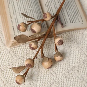 Close-up of beige brown artificial berry branch