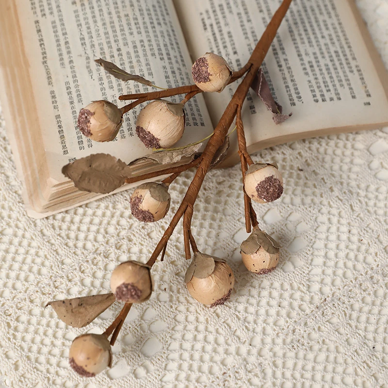 Close-up of beige brown artificial berry branch
