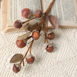 Close-up of burgundy artificial berry branch