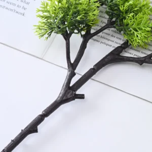 Branch and foliage attachment detail shared by compact-cluster and open-canopy artificial bonsai stems