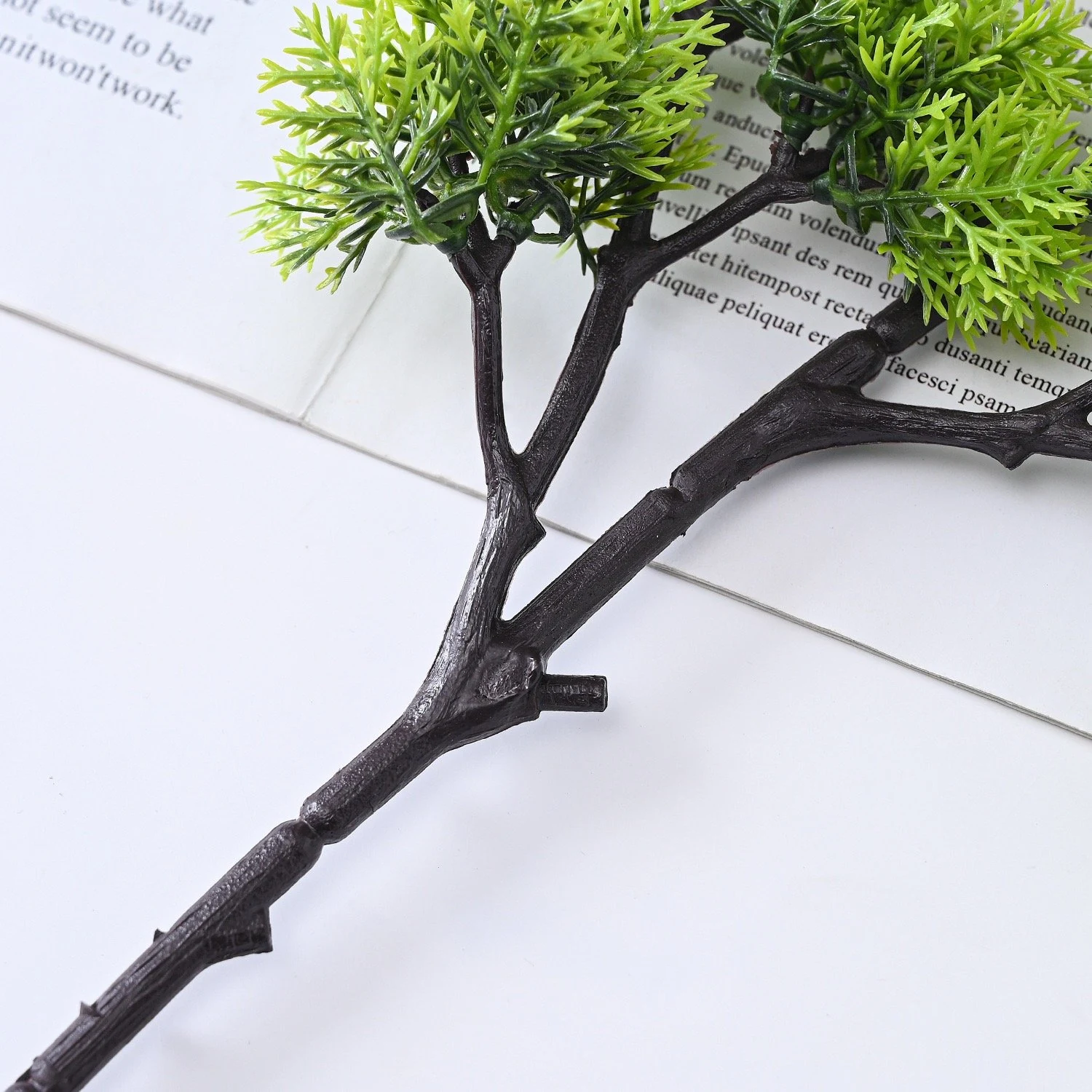 Branch and foliage attachment detail shared by compact-cluster and open-canopy artificial bonsai stems