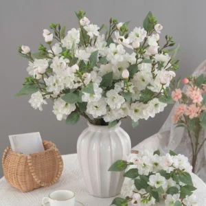 White artificial Camellia Flower Branch arranged for decorative display
