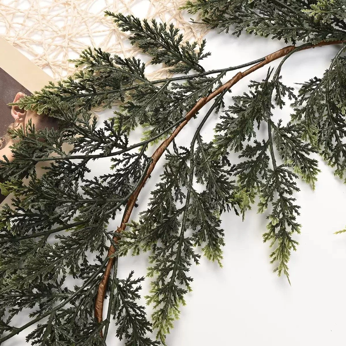 Wrapped central stem and branch connections of artificial cedar garland