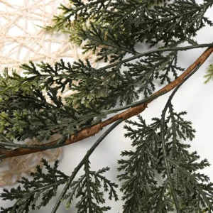 Close-up of layered artificial cedar foliage