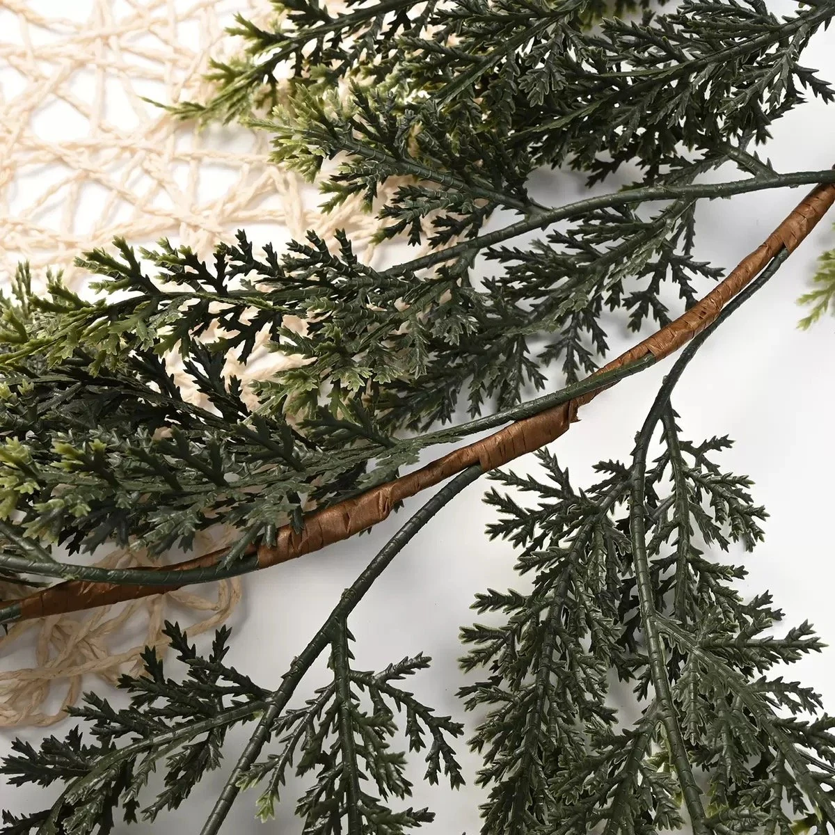 Close-up of layered artificial cedar foliage