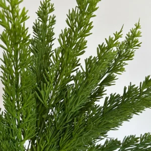 Close-up of dark green artificial cedar greenery bush