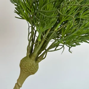 Close-up of stem artificial cedar greenery bush