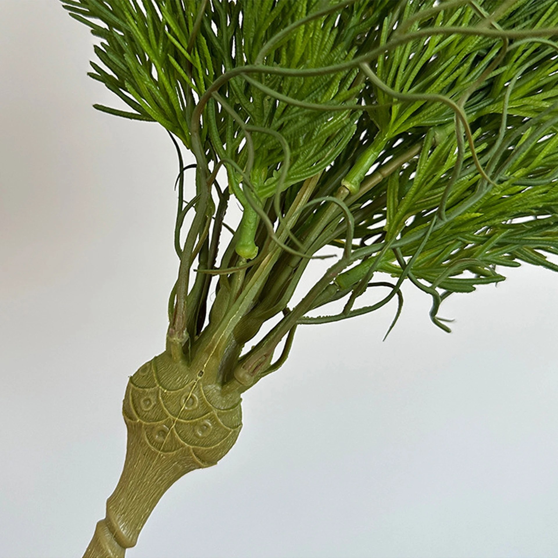 Close-up of stem artificial cedar greenery bush