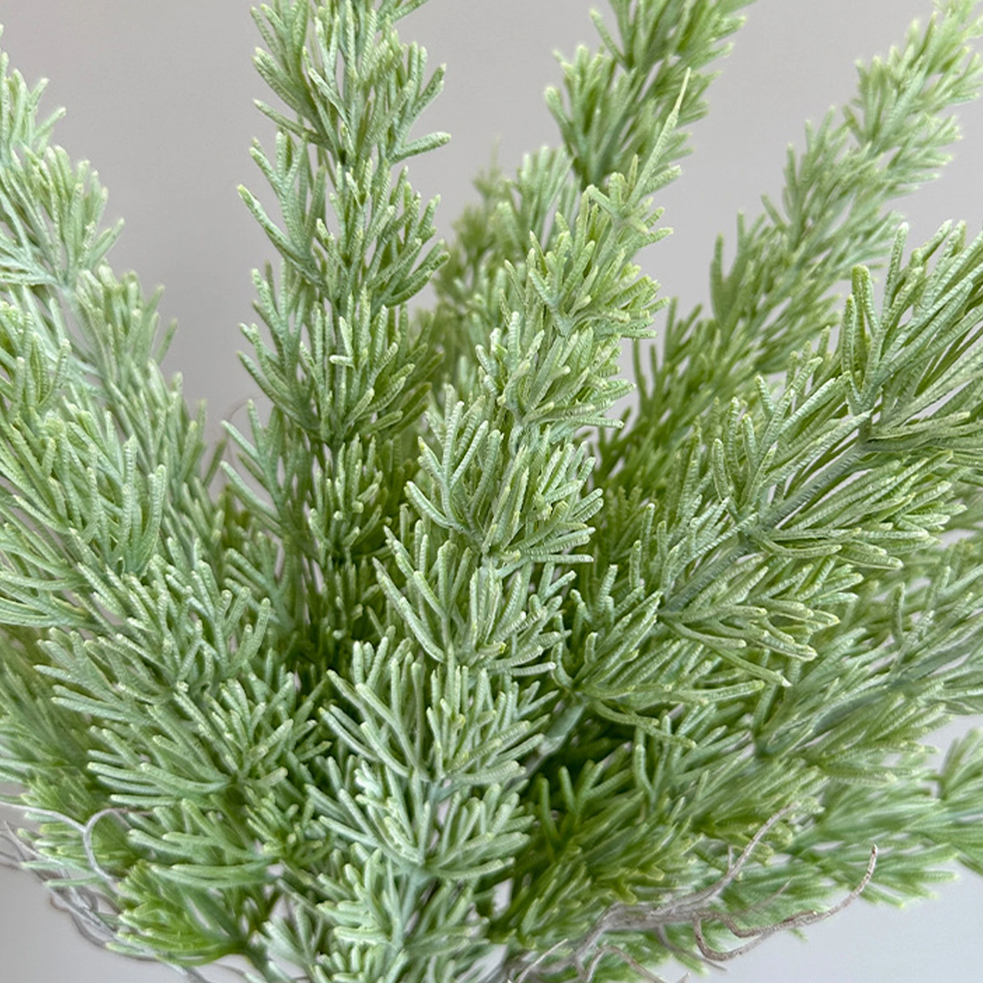 Close-up of white artificial cedar greenery bush