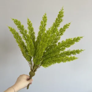 Yellow artificial cedar greenery bush