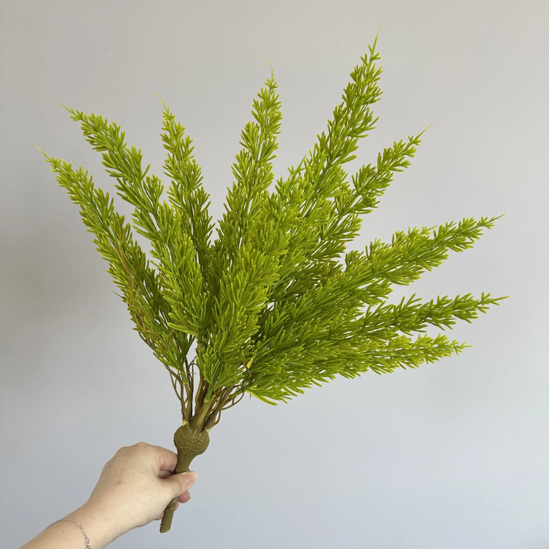 Yellow artificial cedar greenery bush
