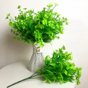 Artificial Clover and Fern Greenery Bush arranged for decorative display