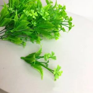 Close-up of artificial Clover and Fern Greenery Bush branch