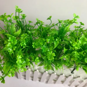 Artificial Clover and Fern Greenery Bush arranged for decorative display