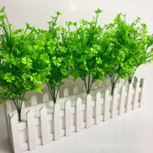 Artificial Clover and Fern Greenery Bush arranged for decorative display