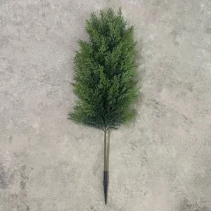 Full artificial cypress topiary tree laid flat with ground spike
