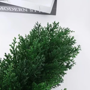 Close-up of green artificial cypress foliage