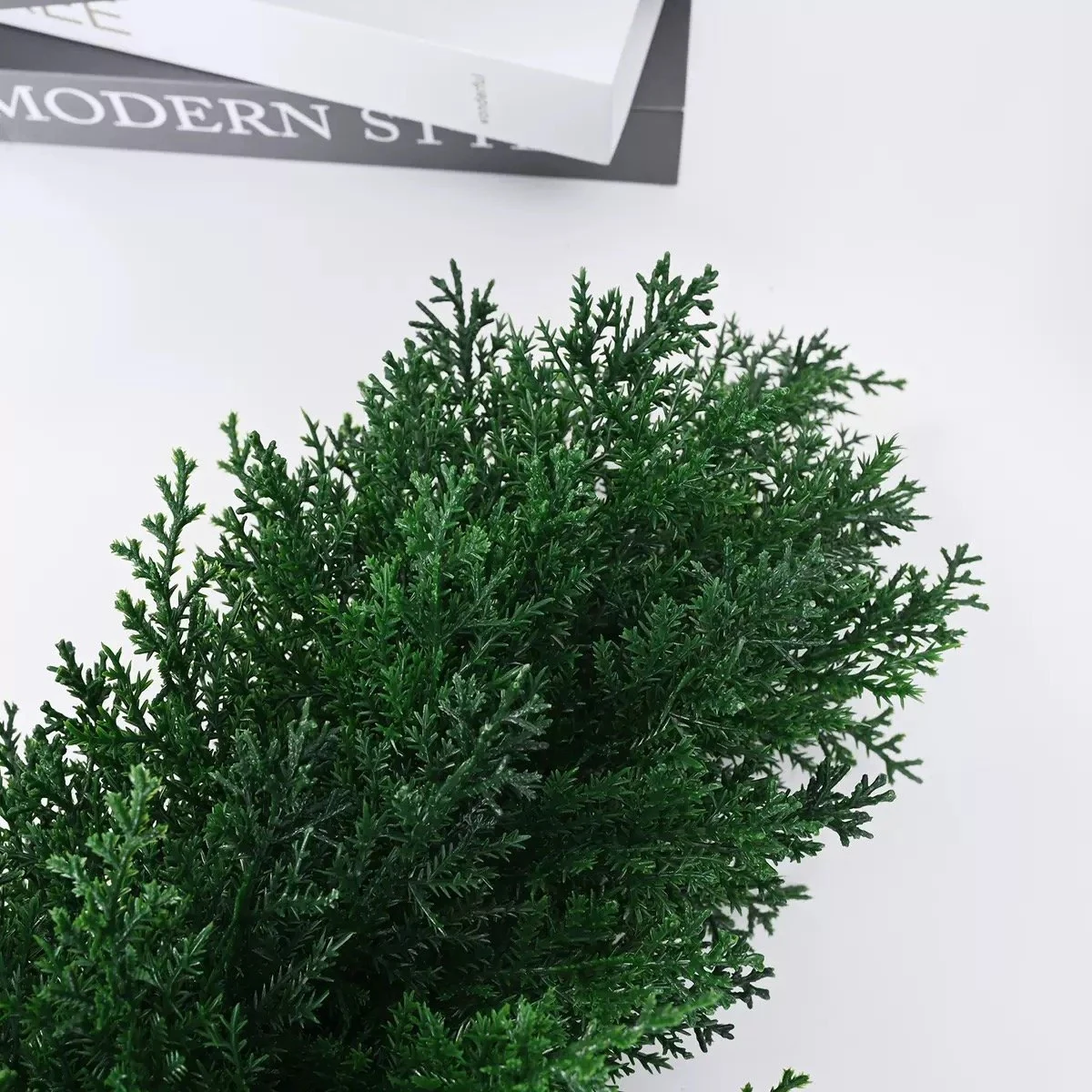 Close-up of green artificial cypress foliage