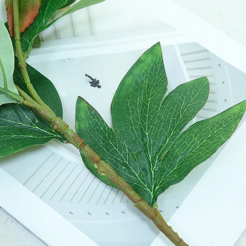 Close-up of leaf detail for artificial double-head peony stem