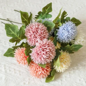 Mixed pink, light blue and white artificial pompon chrysanthemum stems arranged together