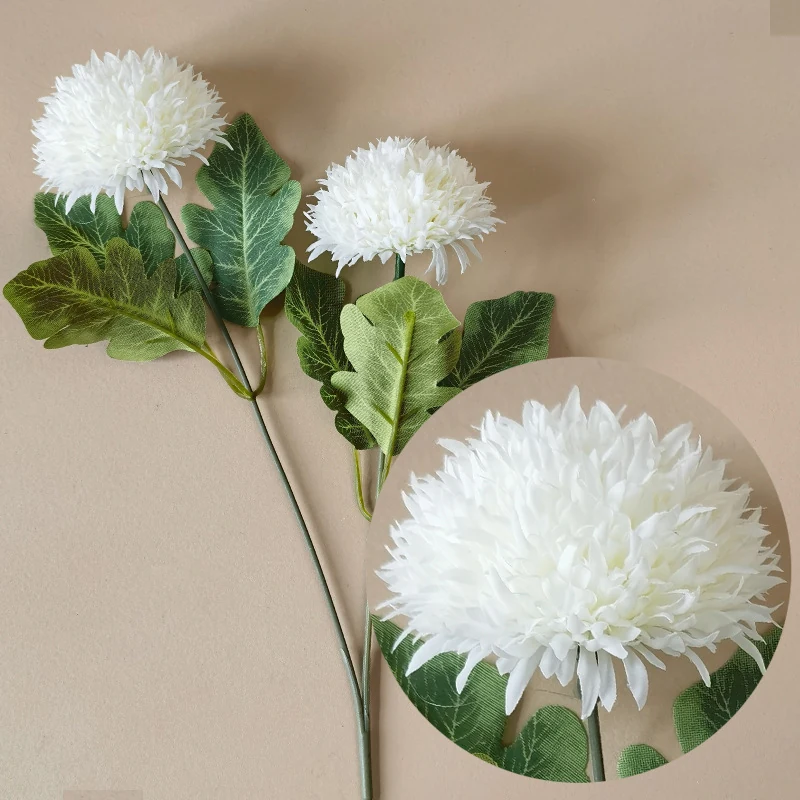 White artificial double-head pompon chrysanthemum stem on a neutral background