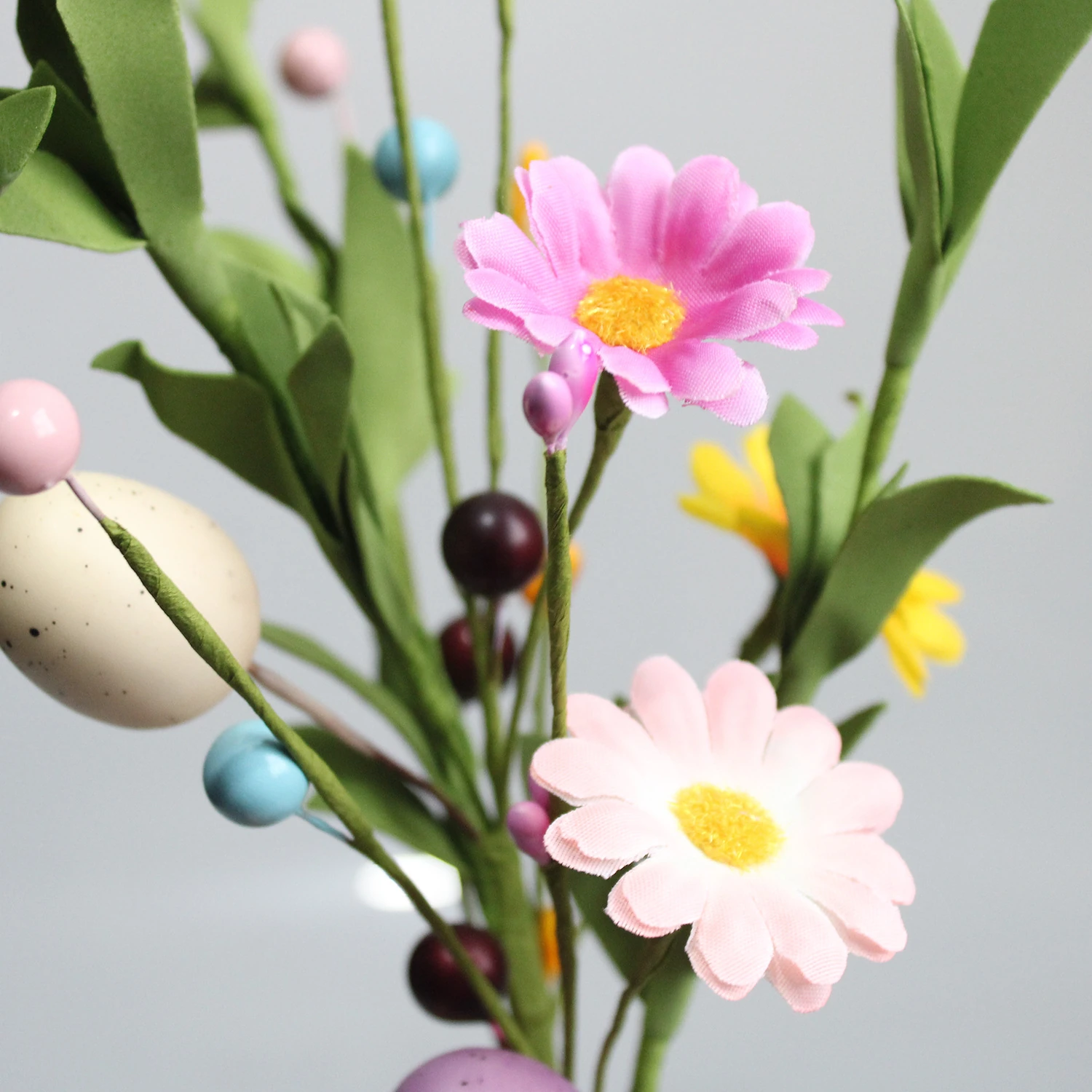 Close-up of flower artificial easter egg daisy flower pick