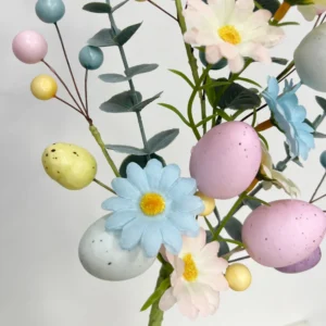 Close-up of egg and flower artificial easter egg eucalyptus flower pick