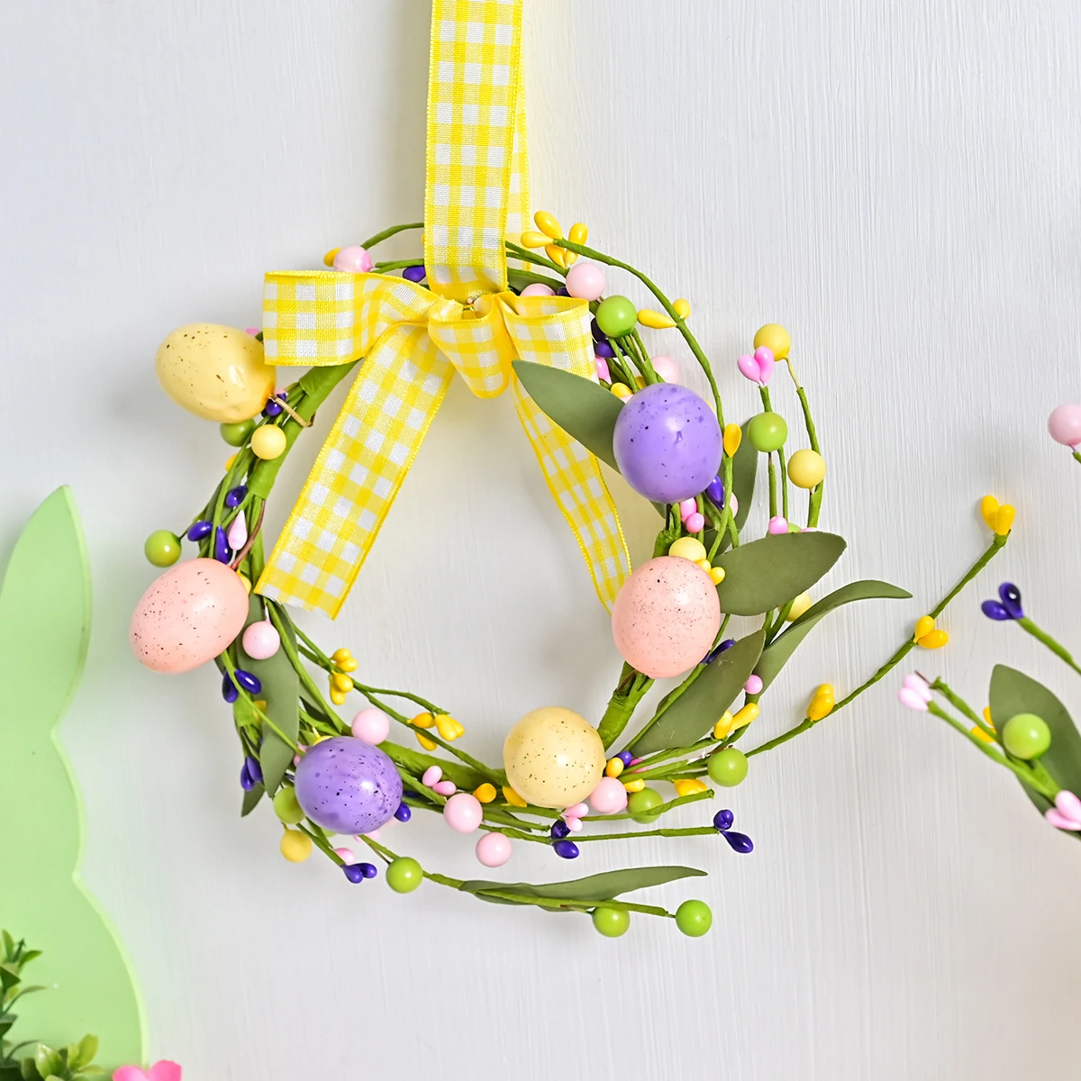 Artificial Easter Egg Twig Wreath shown in a decorative display