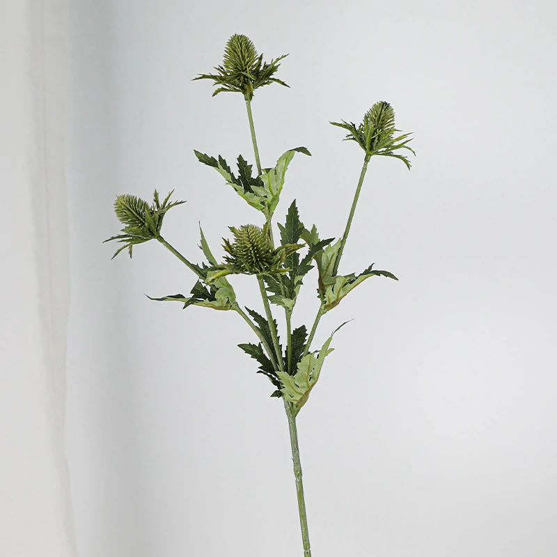 Close-up of white artificial eryngium thistle spray