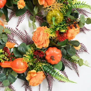 Close-up of flower artificial fall pumpkin rose wreath