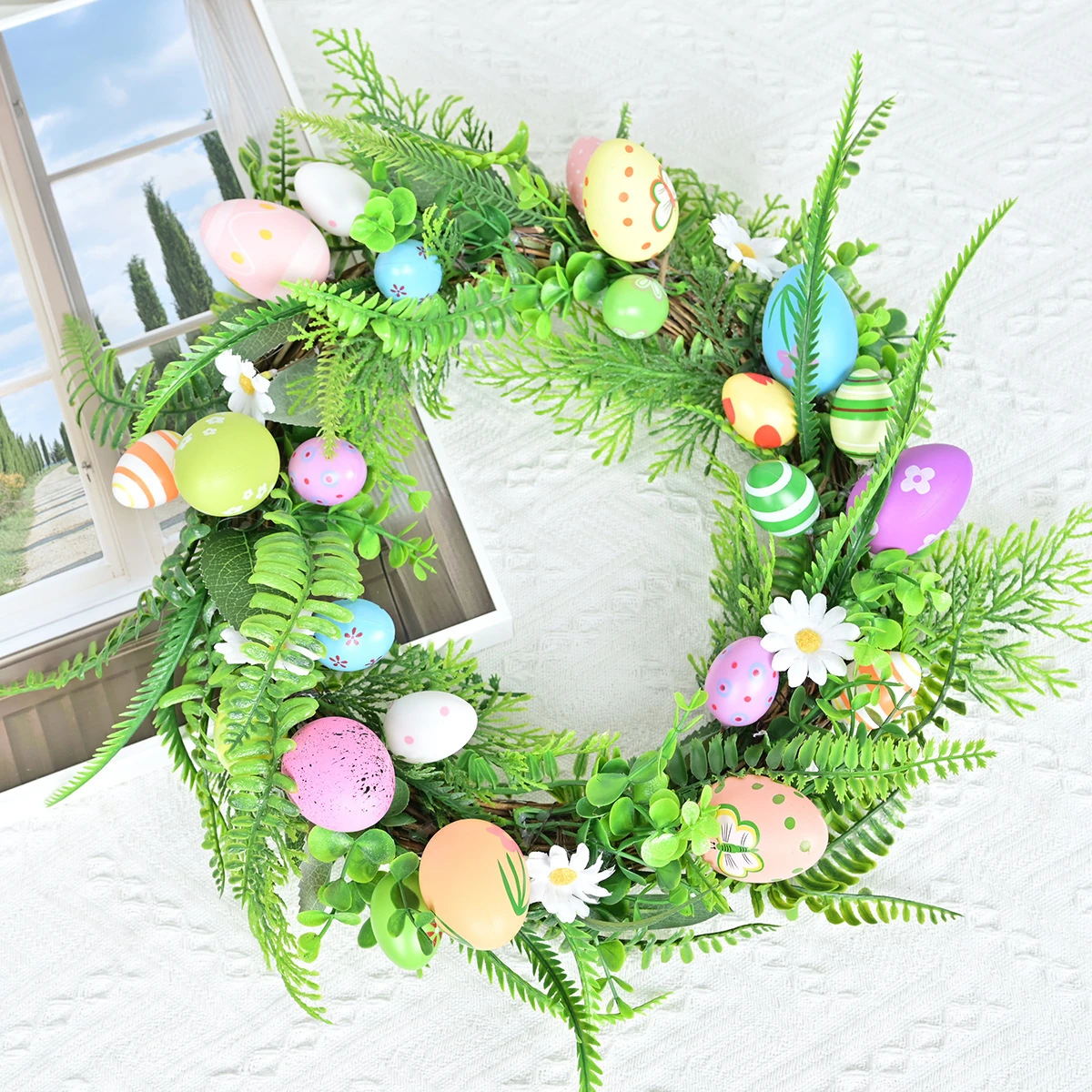 Artificial Fern Easter Egg Wreath shown in a decorative display