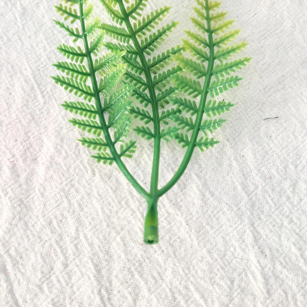 Close-up of artificial Fern Leaf Pick stem