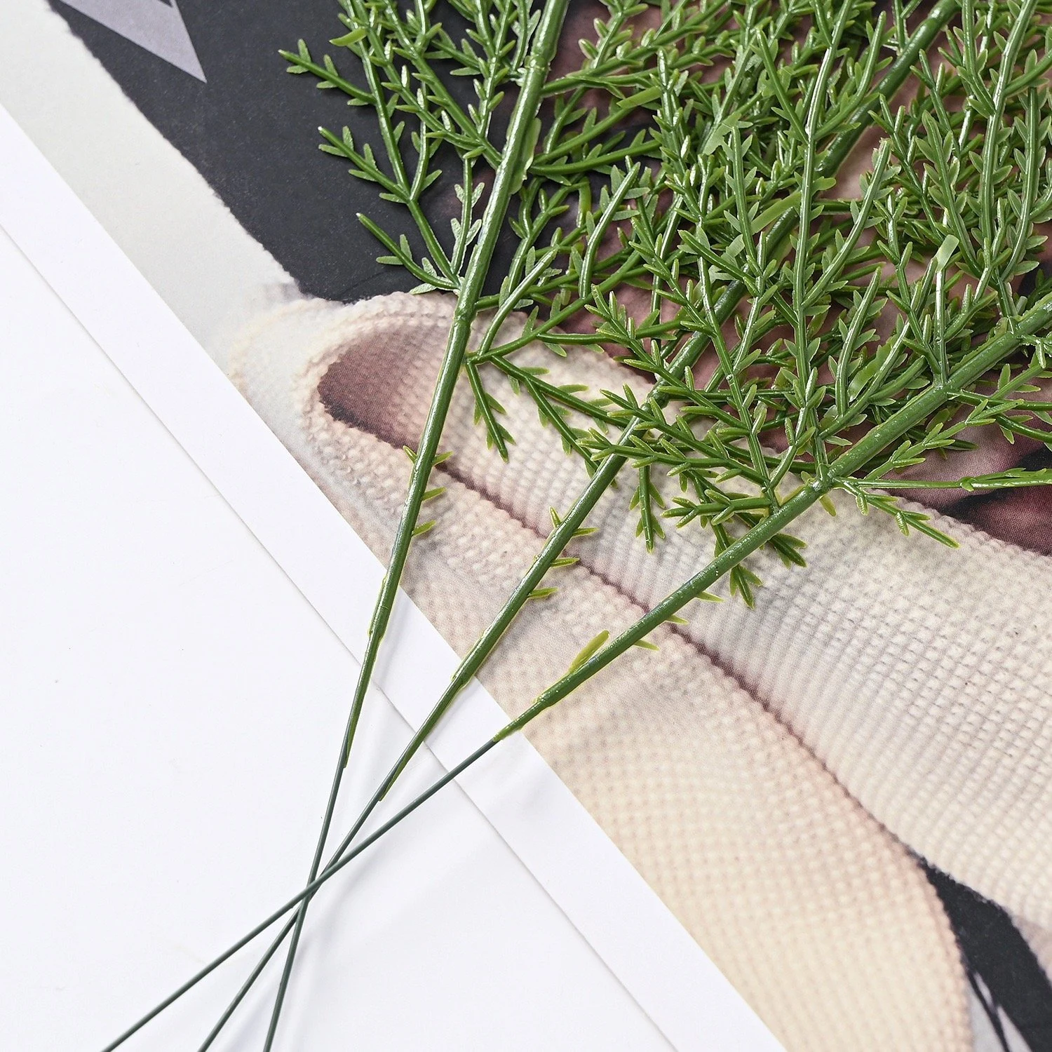 Close-up of fine green branchlets on artificial flat cedar foliage sprays