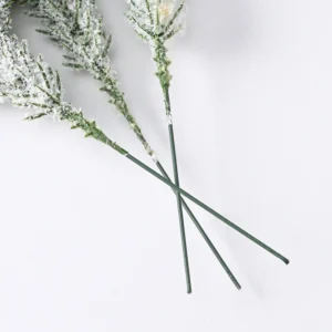 Stem detail of artificial flocked snow pine picks