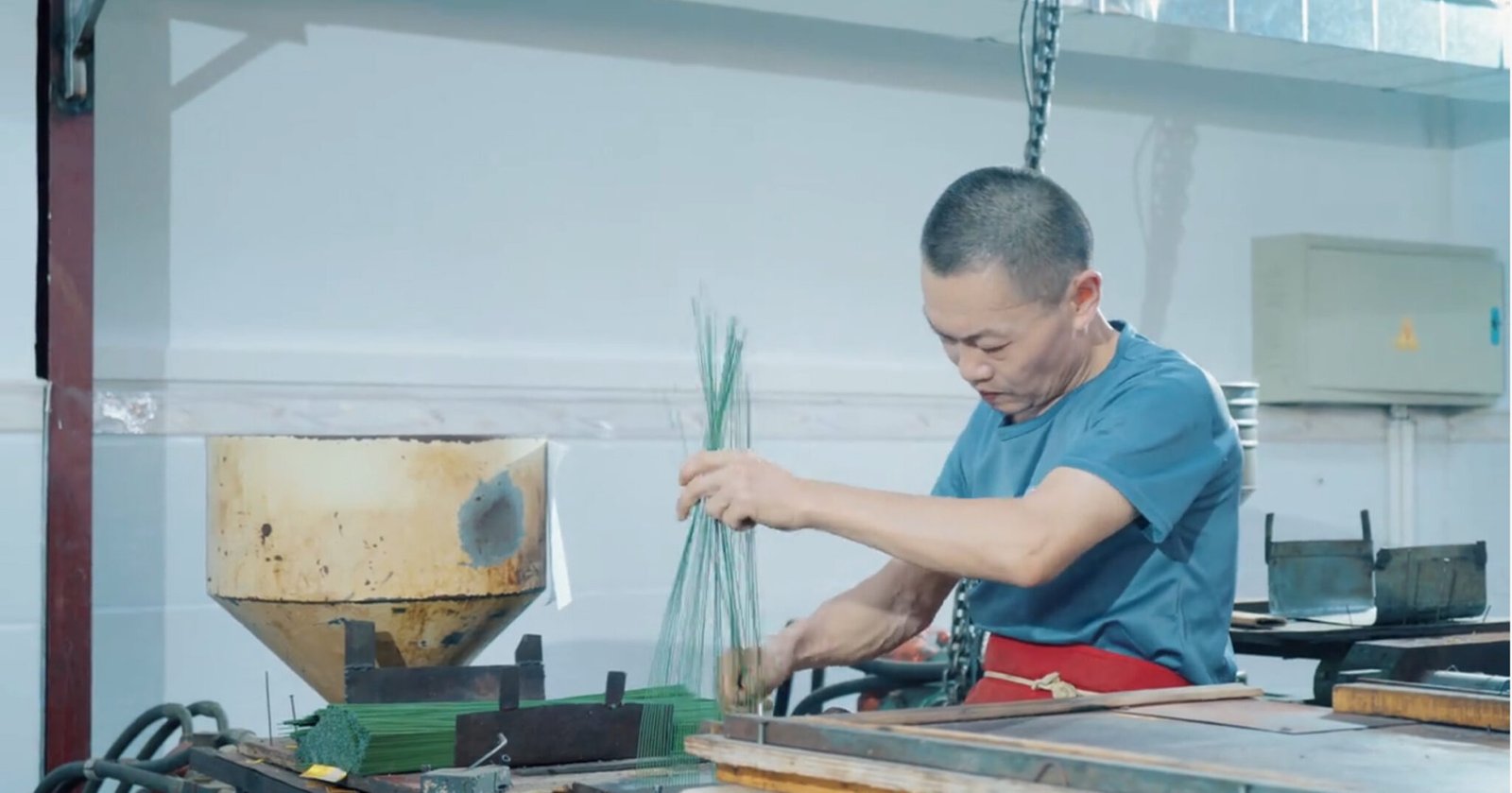 Measuring an approved artificial flower sample before production