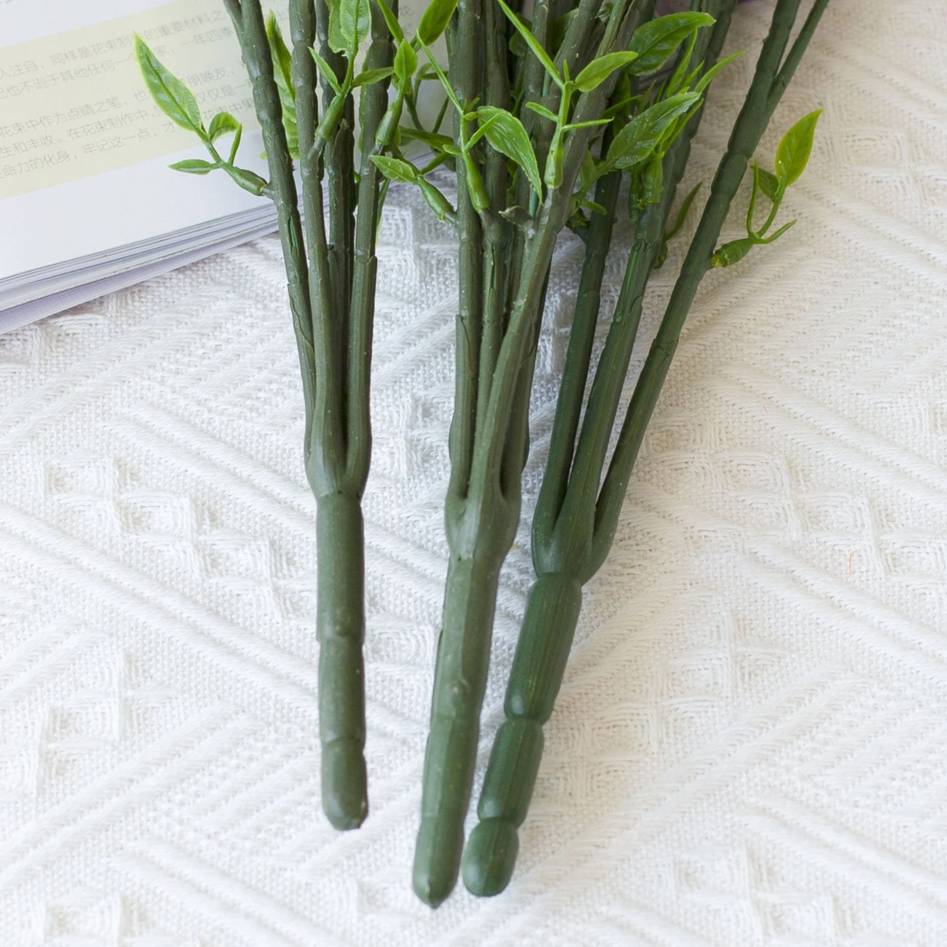 Close-up of artificial Forsythia Flower Bush stem