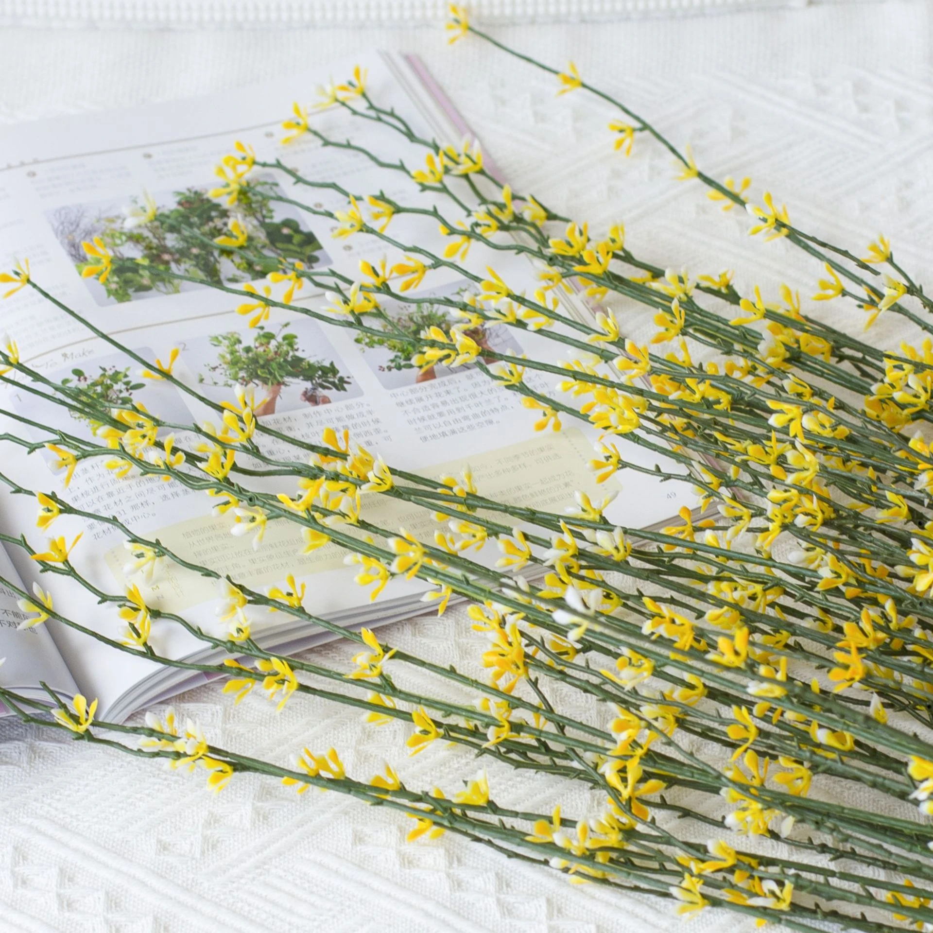 Close-up of artificial Forsythia Flower Bush yellow