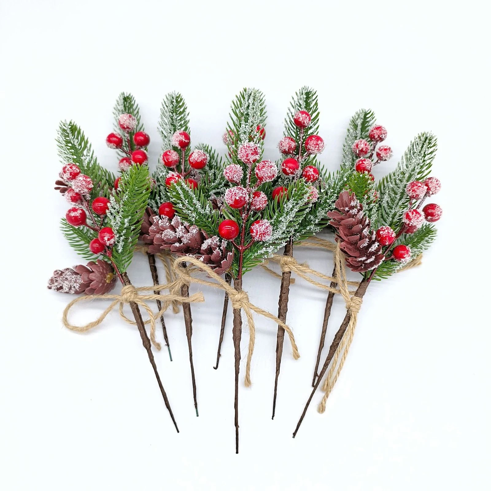 Multiple artificial frosted pinecone and berry Christmas picks