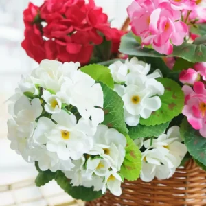 Close-up of white and pink artificial geranium flower clusters