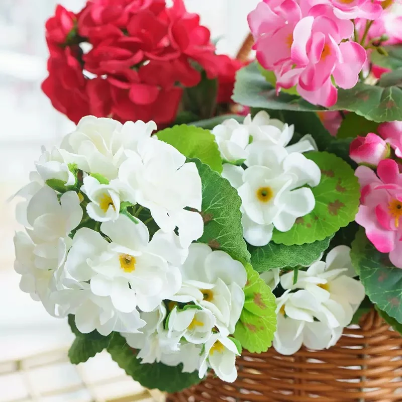 Close-up of white and pink artificial geranium flower clusters