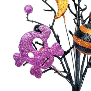 Close-up of detail artificial halloween bat skull pumpkin pick