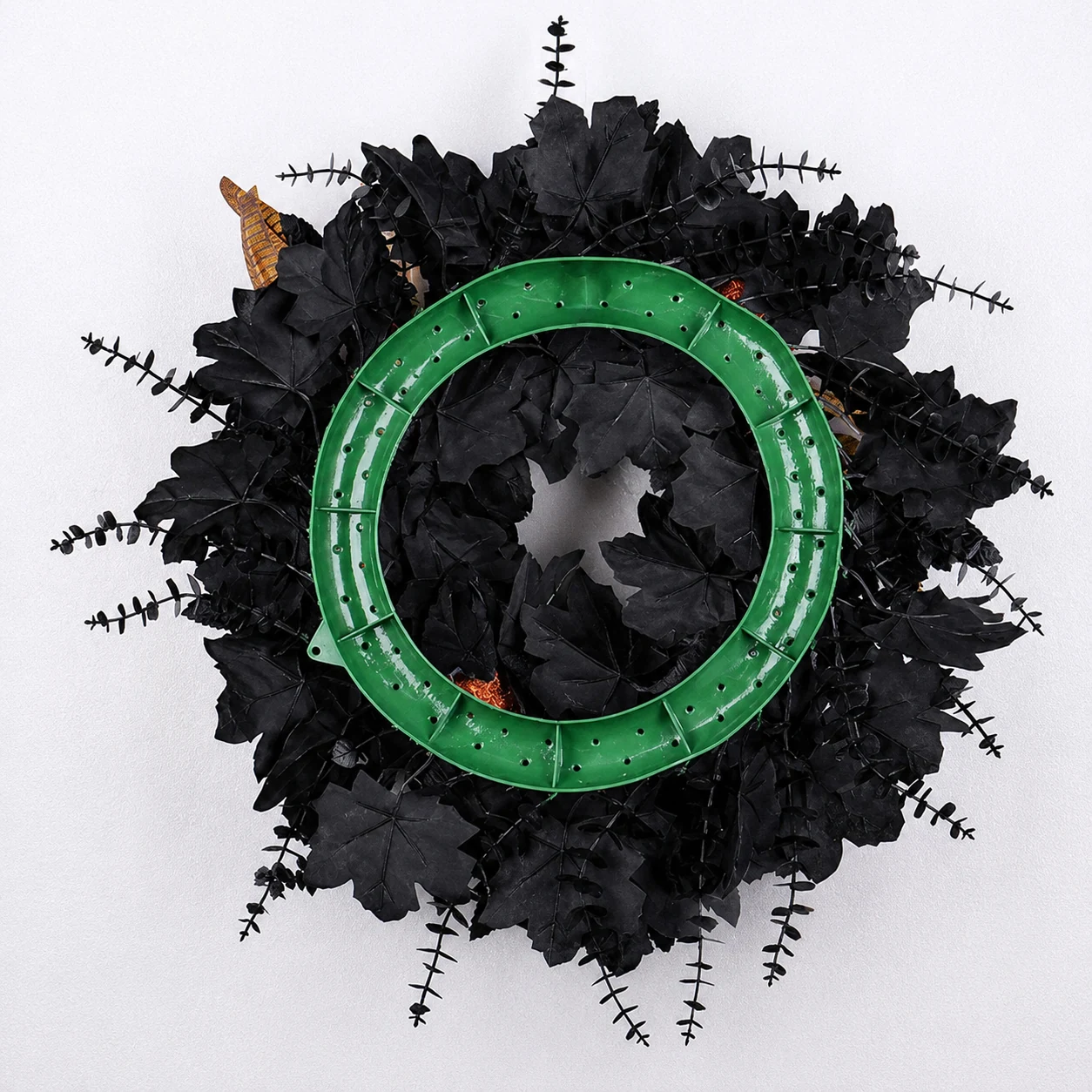 Back construction of artificial Halloween black leaf wreath