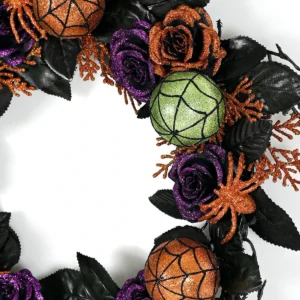 Close-up of detail artificial halloween pumpkin rose spider wreath